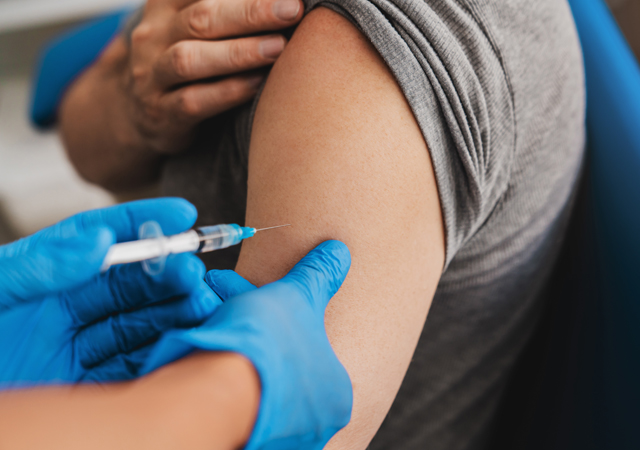 Doctor-Giving-Pneumococcal-Jab-to-a-Patient-in-Clinic