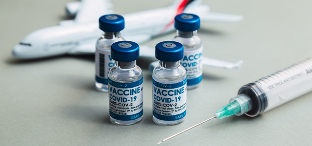 Travel-Vaccine-and-Syringe-on-a-Table
