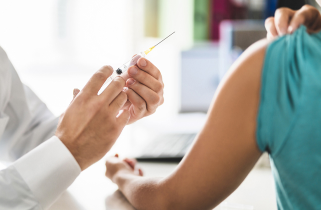 Doctor-Giving-Hepatitis-Vaccine-Injection-to-a-Patien