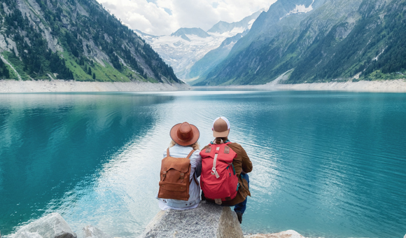 Two-International-Travellers-Sitting-Together